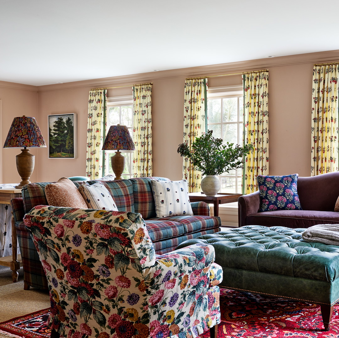 a living room filled with furniture and a fire place