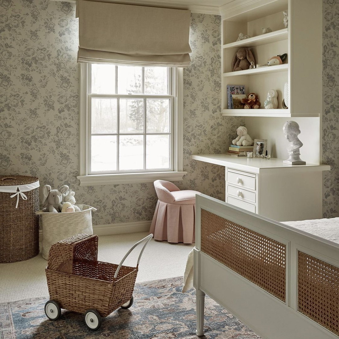 a baby's room with a baby carriage in the middle of the room