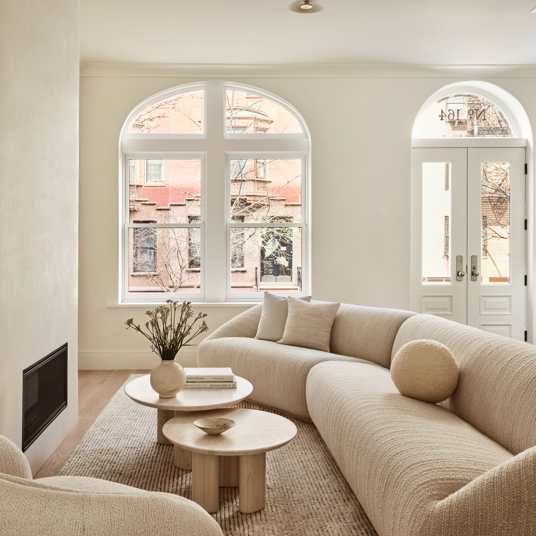 a living room filled with furniture and a fire place