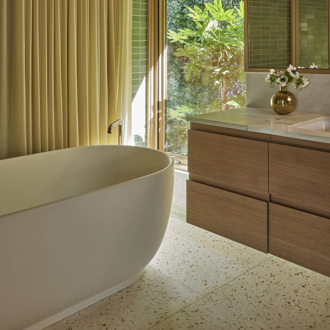 a bathroom with a tub and a sink