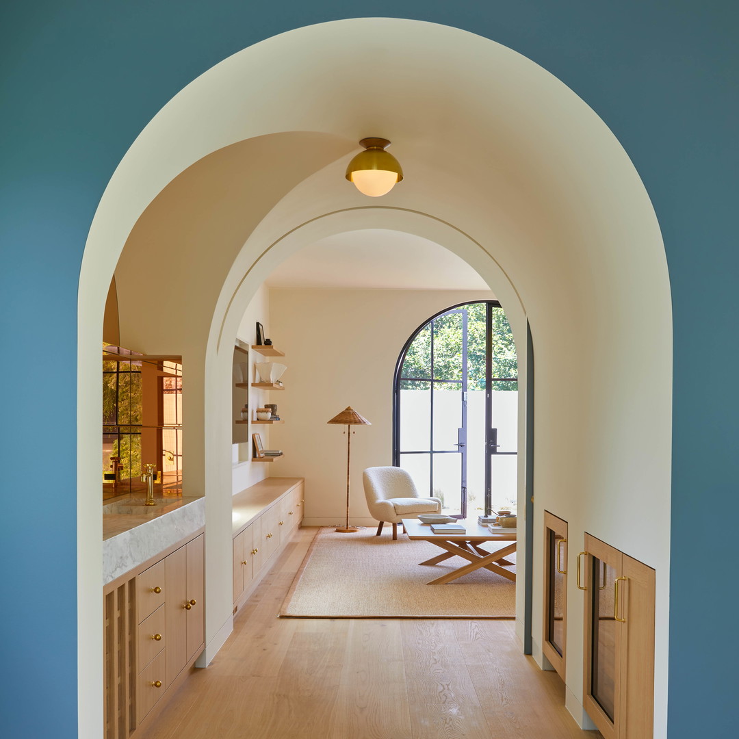 an archway leading to a living room and dining room