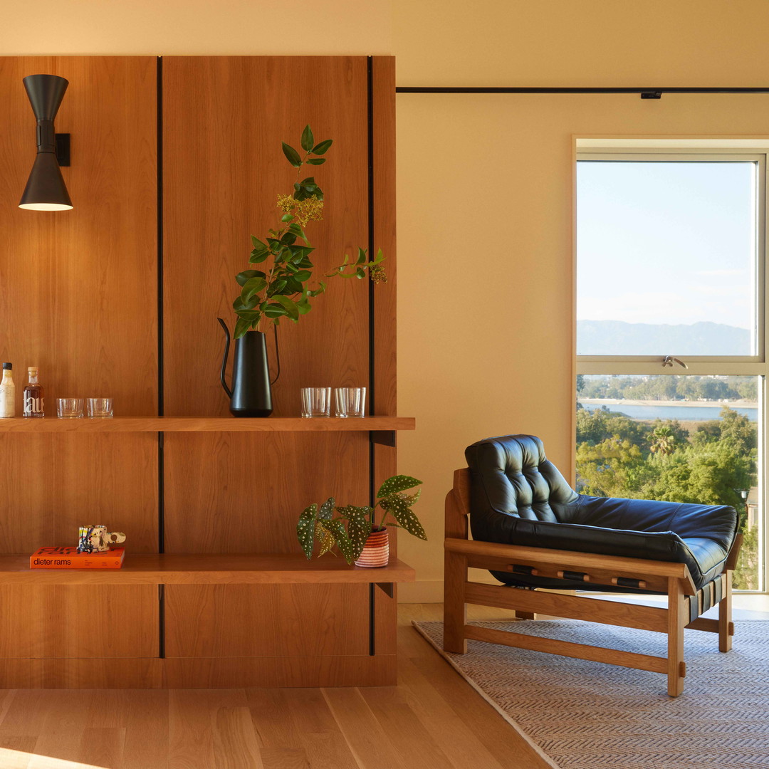 a living room filled with furniture and a window