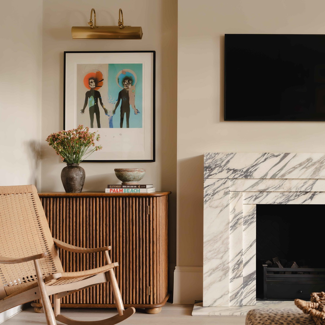 a living room filled with furniture and a fire place