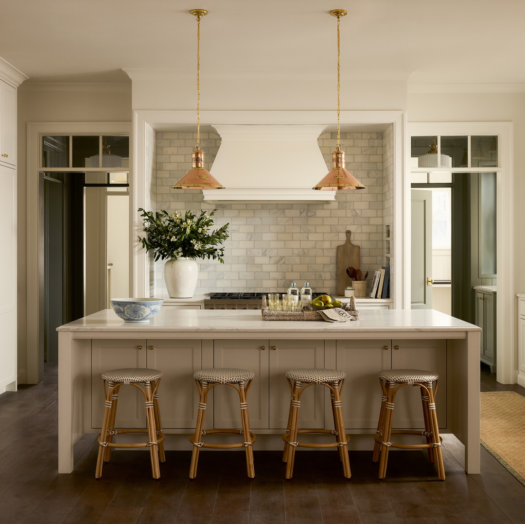 a kitchen with a center island with stools