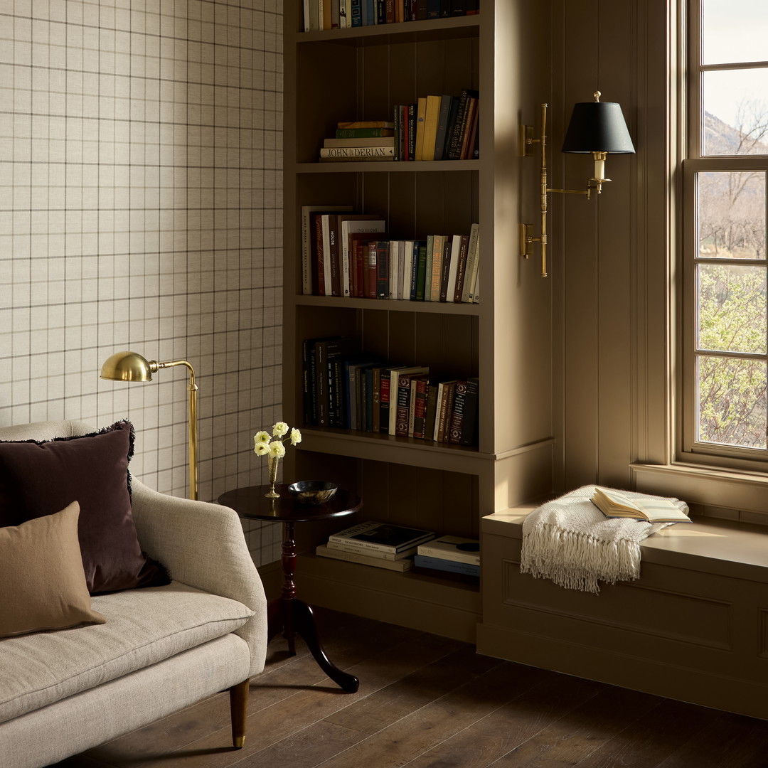 a living room filled with furniture and a window