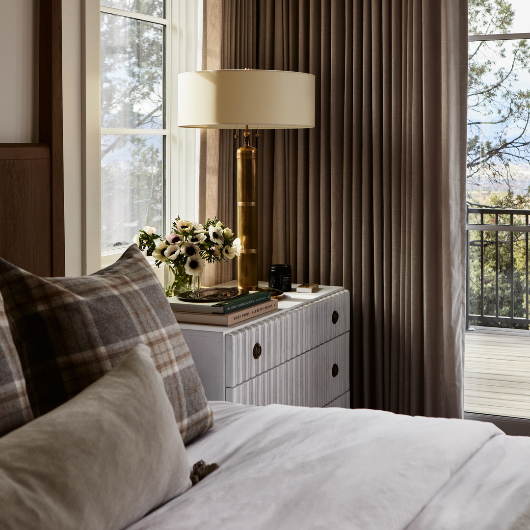 a bedroom with a view of the mountains