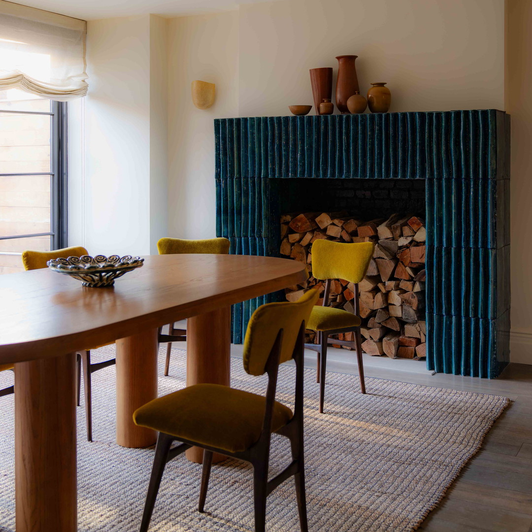 a dining room with a fire place and a fireplace