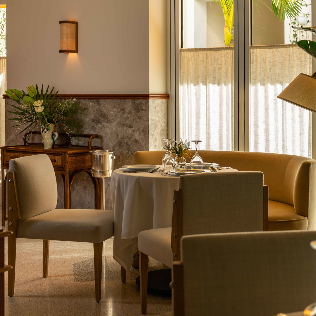 a dining room with a table and chairs