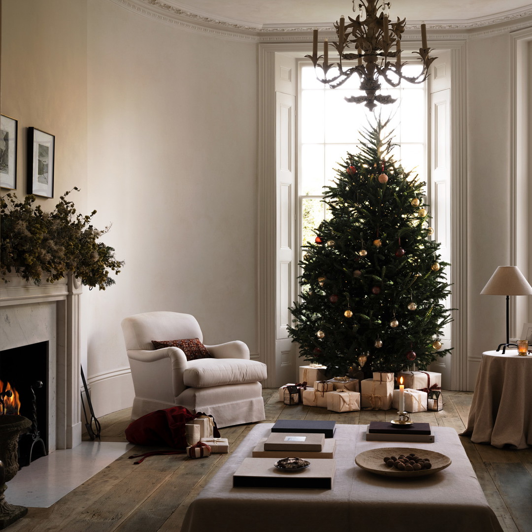 a living room filled with furniture and a christmas tree