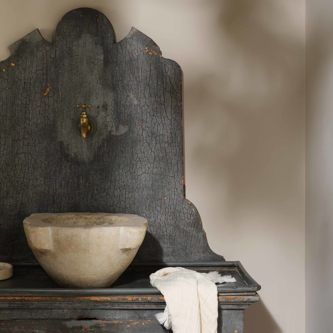 a wooden cabinet with a bowl on top of it