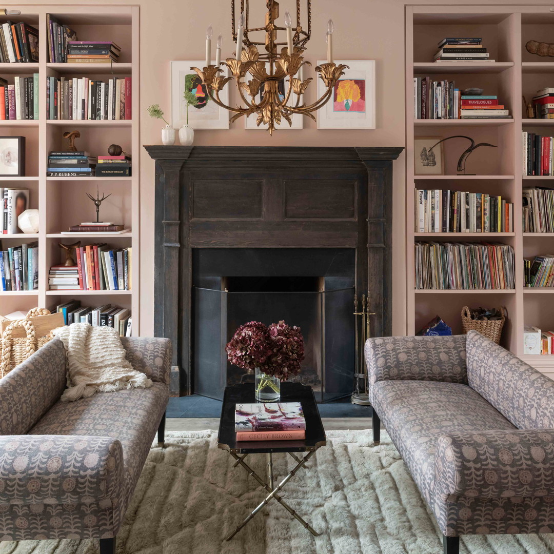 a living room filled with furniture and a fire place