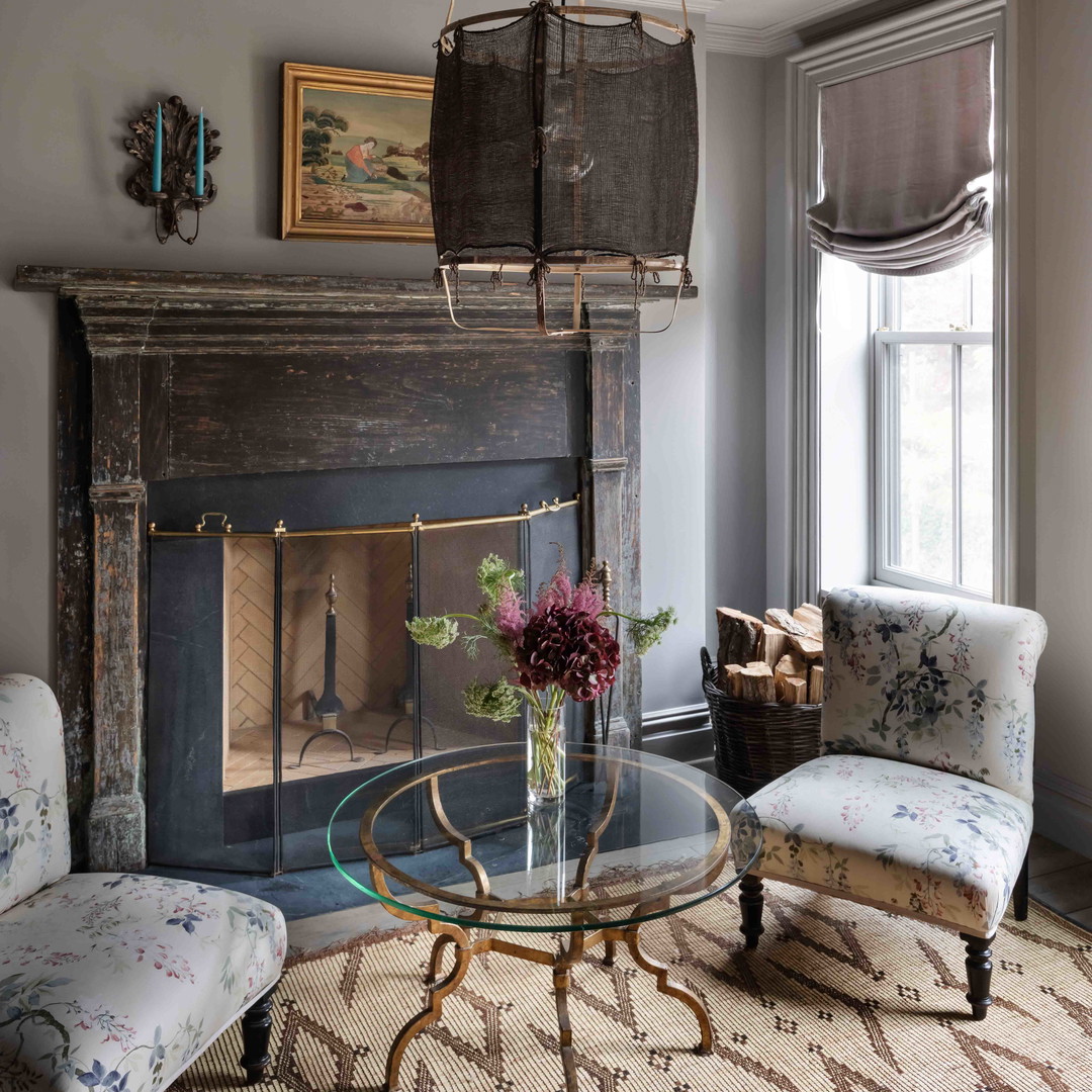 a living room filled with furniture and a fire place