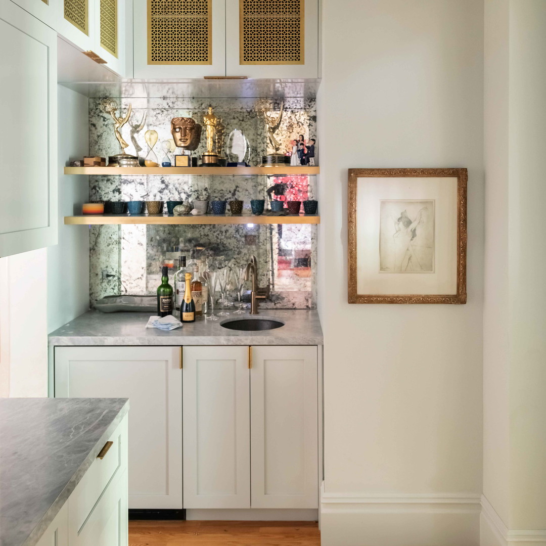 a kitchen with a chandelier hanging from the ceiling