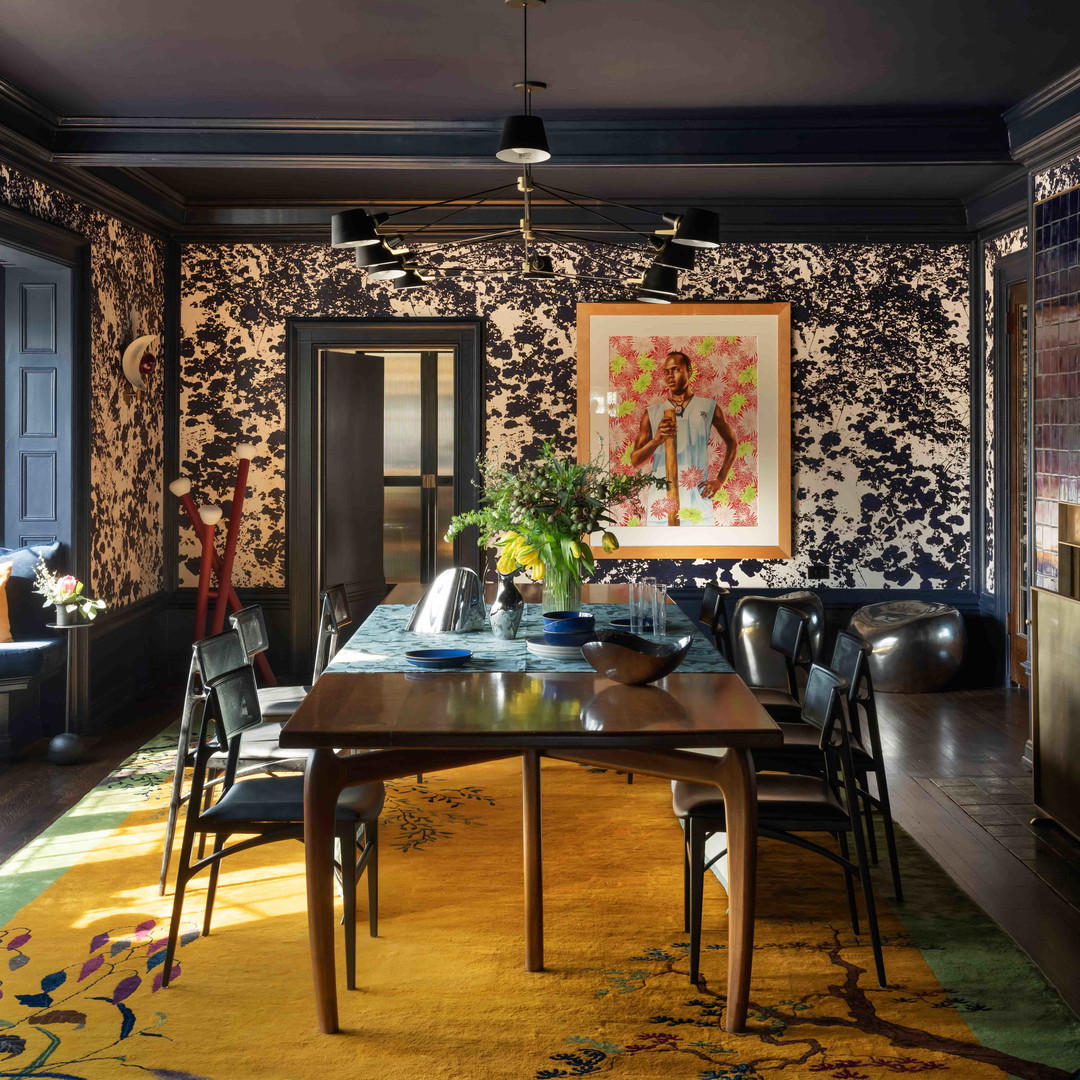 a dining room with a table and chairs