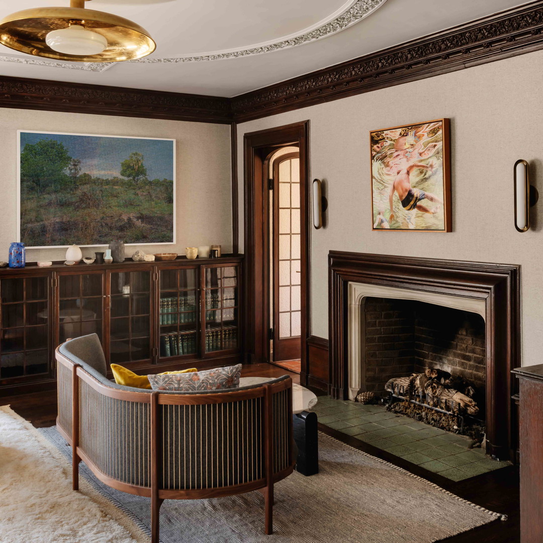 a living room filled with furniture and a fire place