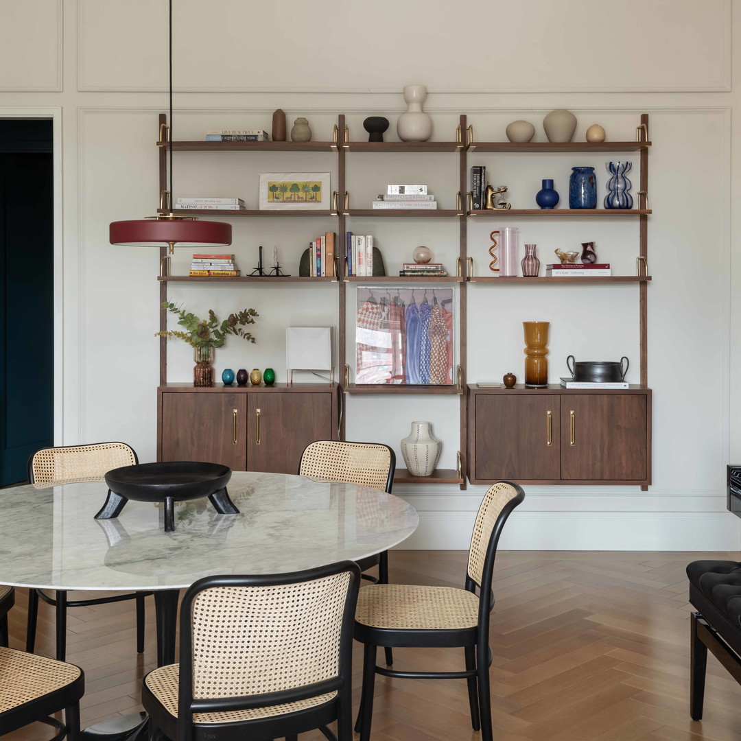 a dining room with a table and chairs