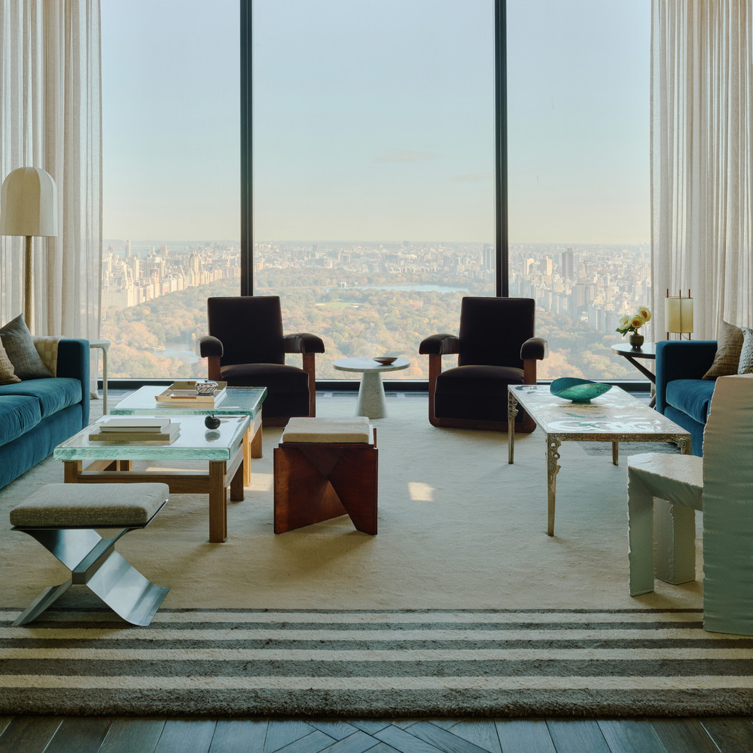 a living room filled with furniture and a large window