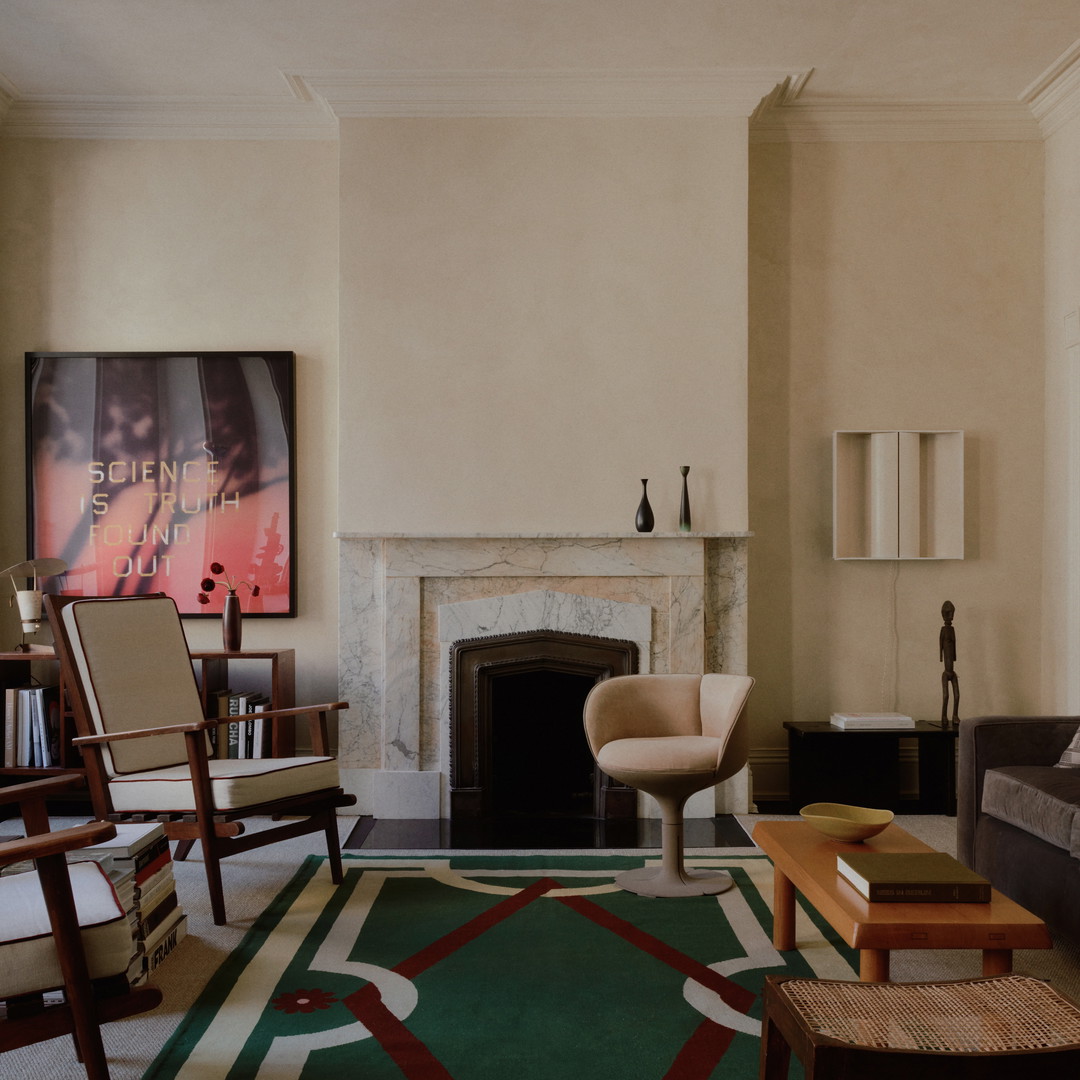 a living room filled with furniture and a fire place