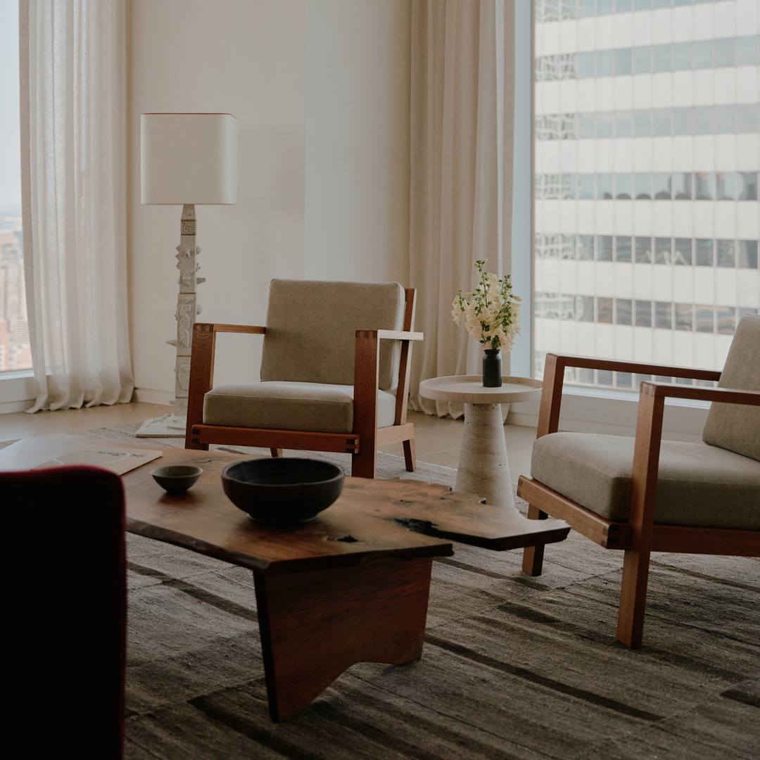 a living room filled with furniture and a large window