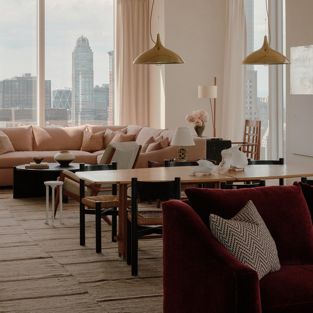 a living room filled with furniture and a large window