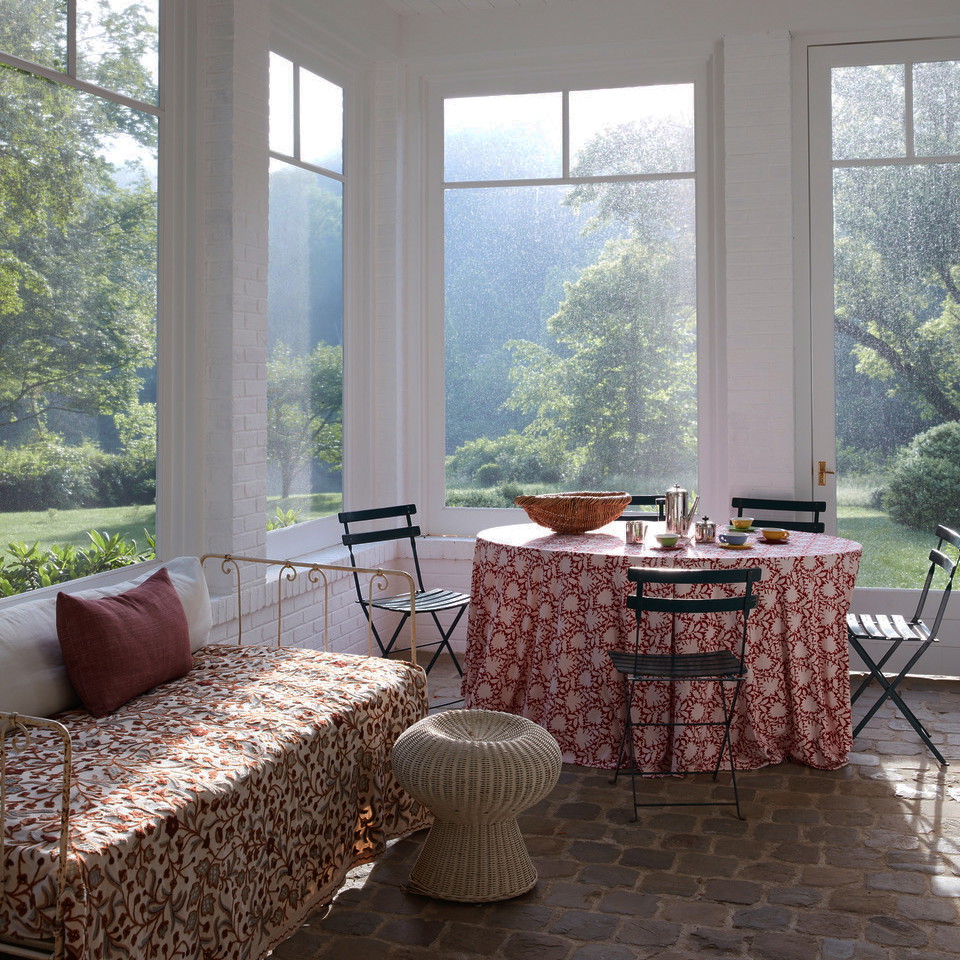 a room with a table and chairs and a bench