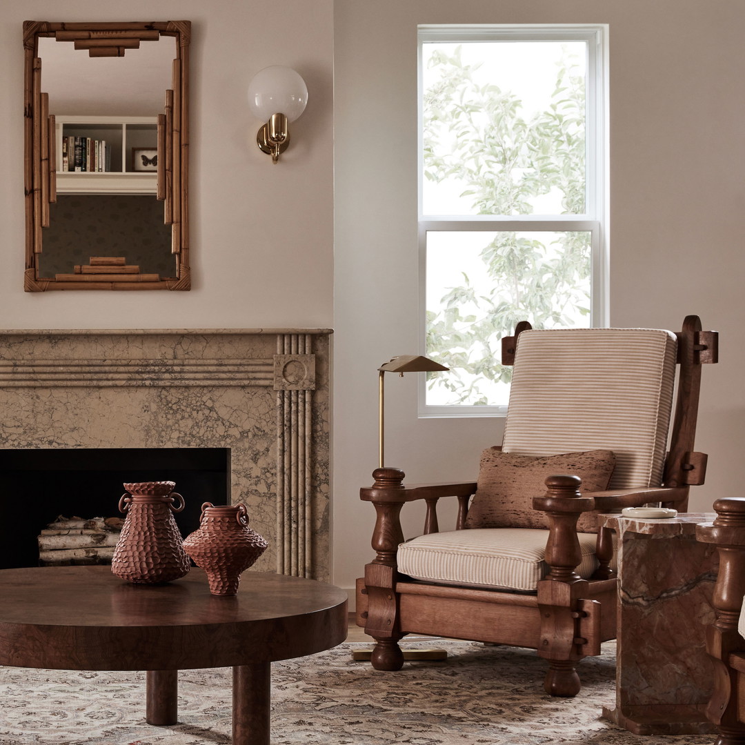 a living room filled with furniture and a fire place