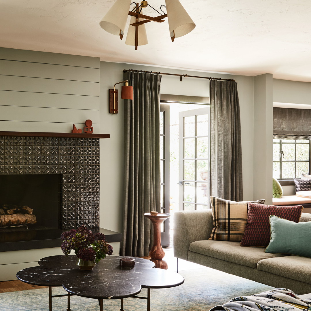 a living room filled with furniture and a fire place