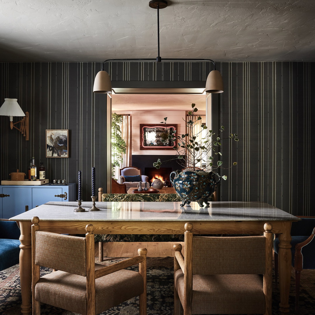 a dining room with a table and chairs