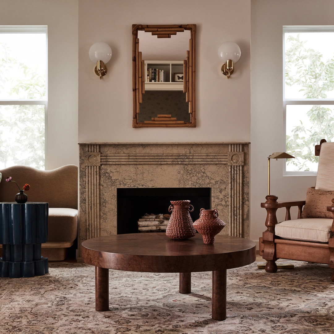 a living room filled with furniture and a fire place