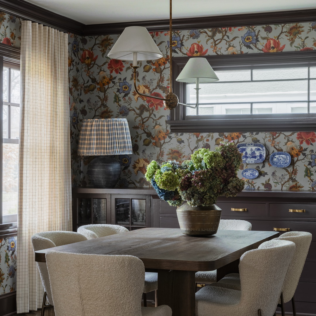 a dining room with a table and chairs