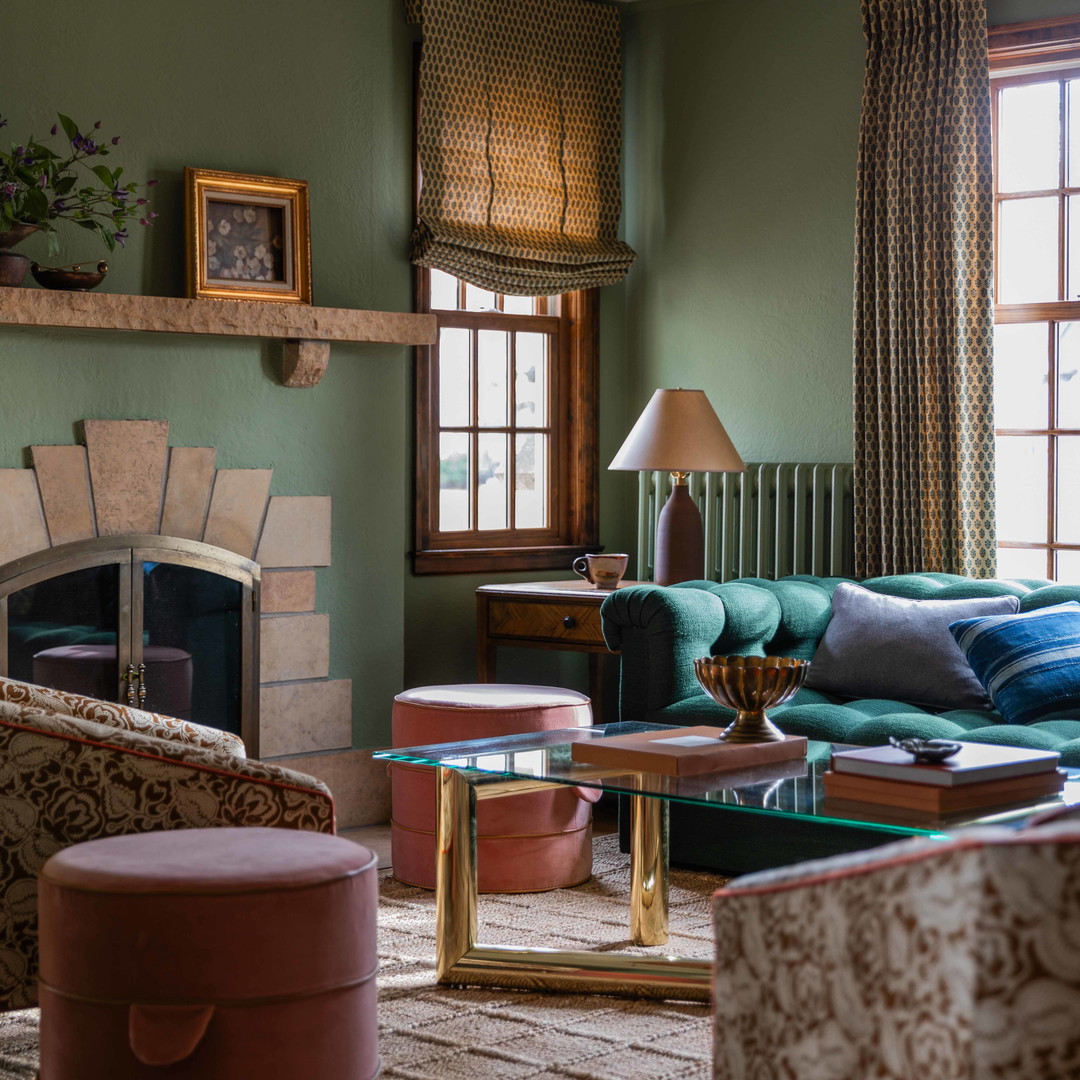 a living room filled with furniture and a fire place