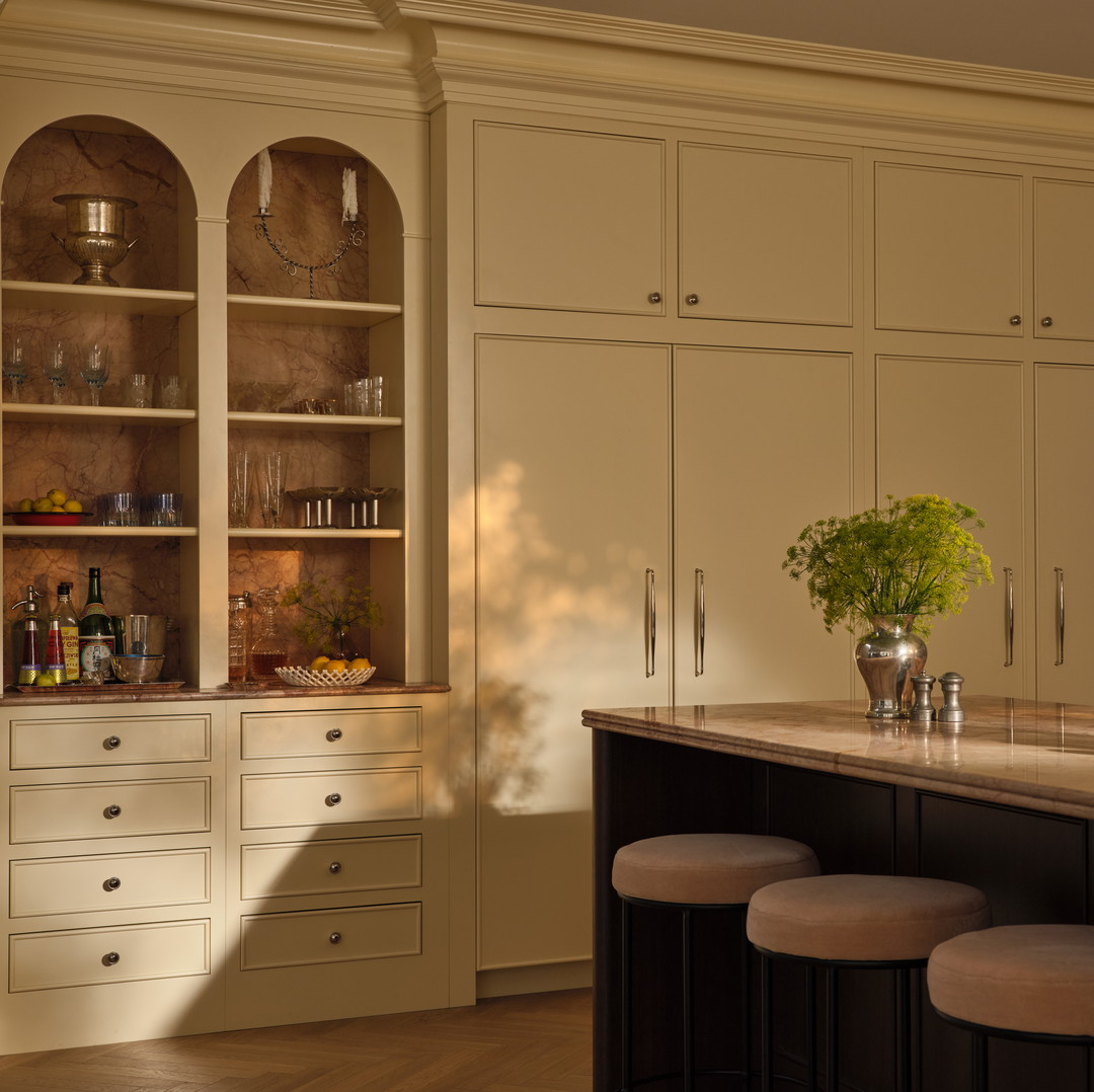 a kitchen with a center island with stools