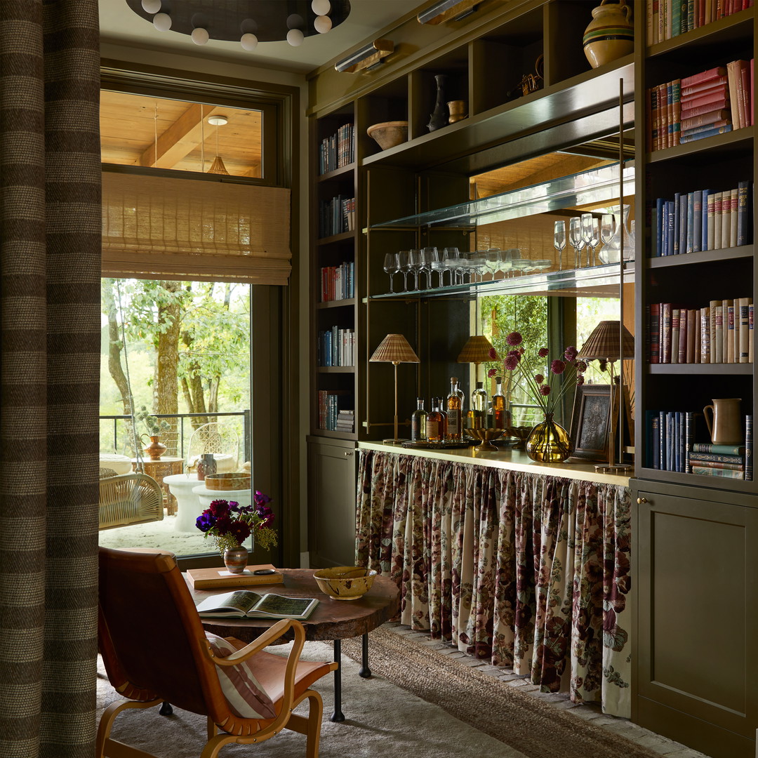 a living room with a book shelf filled with books