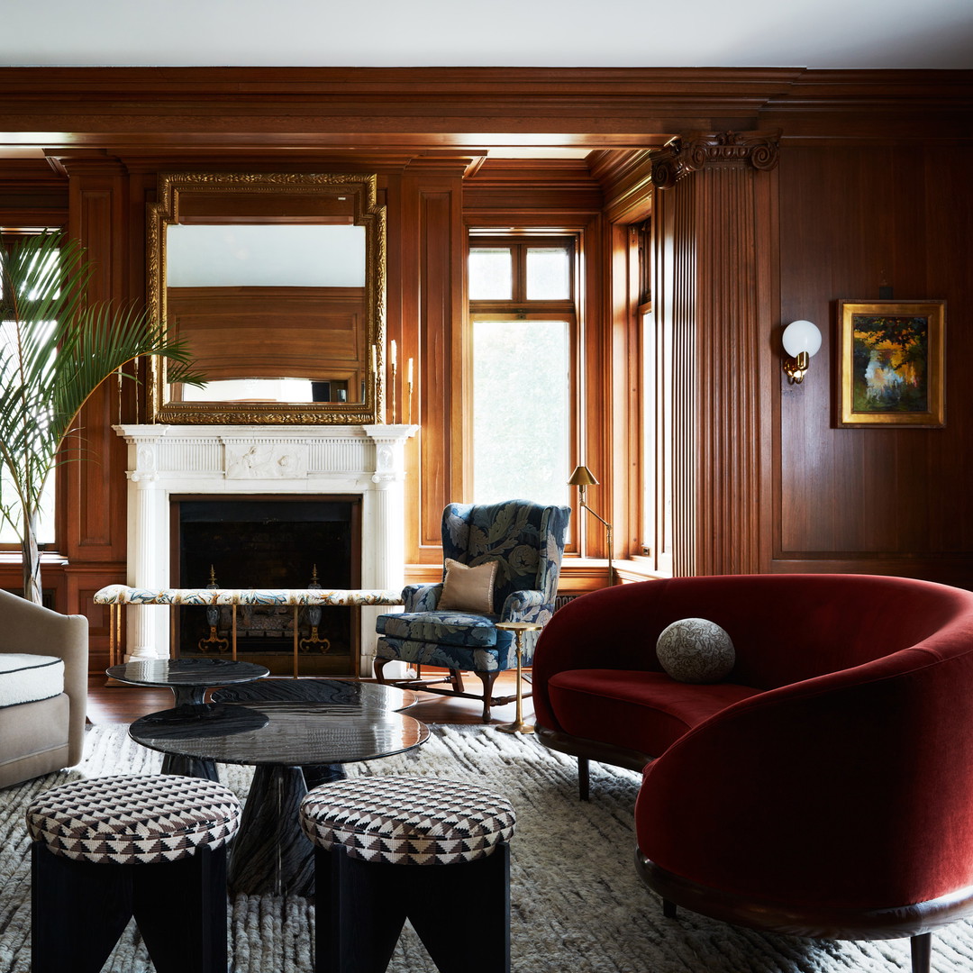 a living room filled with furniture and a fire place