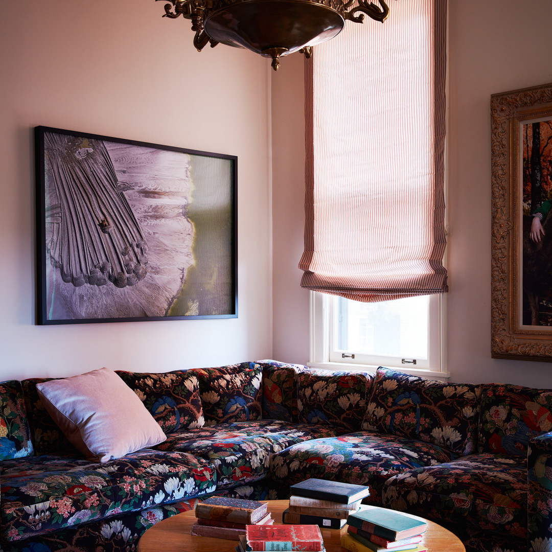 a living room filled with furniture and a chandelier