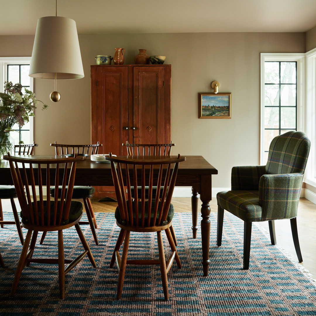 a dining room with a table and chairs