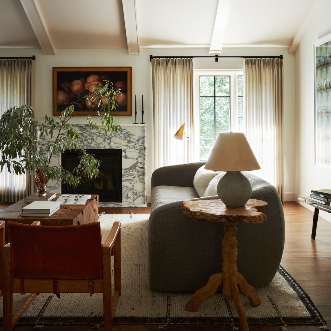 a living room filled with furniture and a fire place