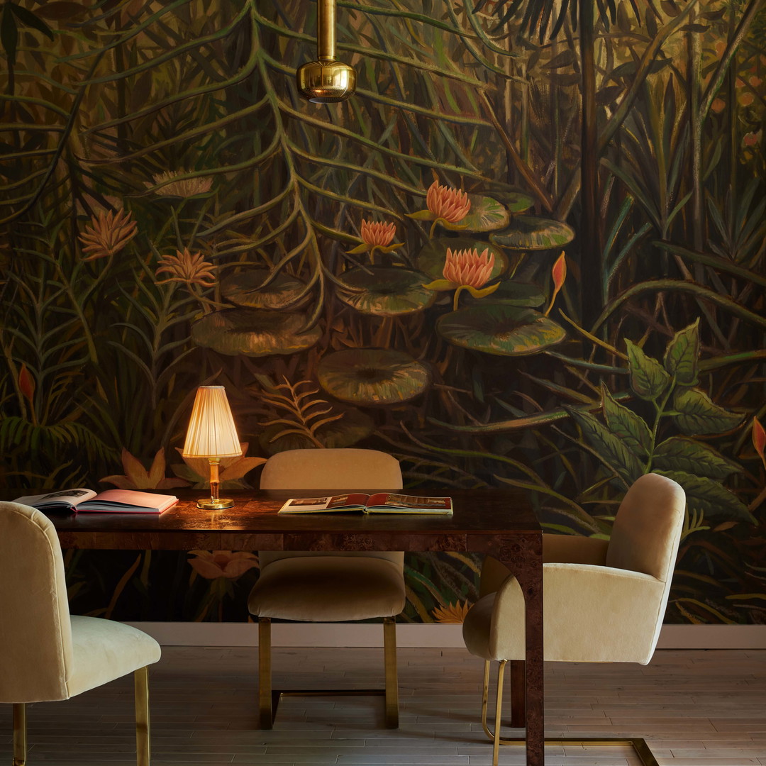 a dining room with a large painting on the wall