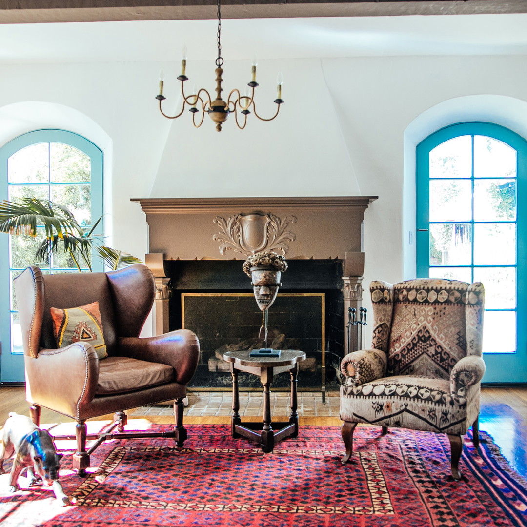 a living room filled with furniture and a fire place