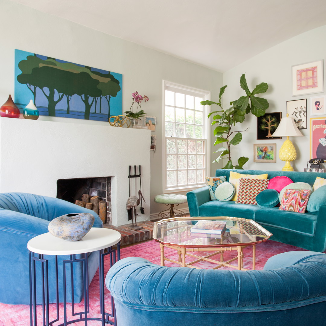 a living room filled with furniture and a fire place