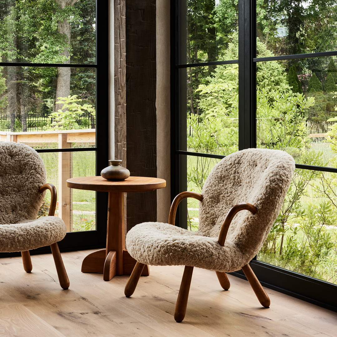 a couple of chairs sitting next to a table