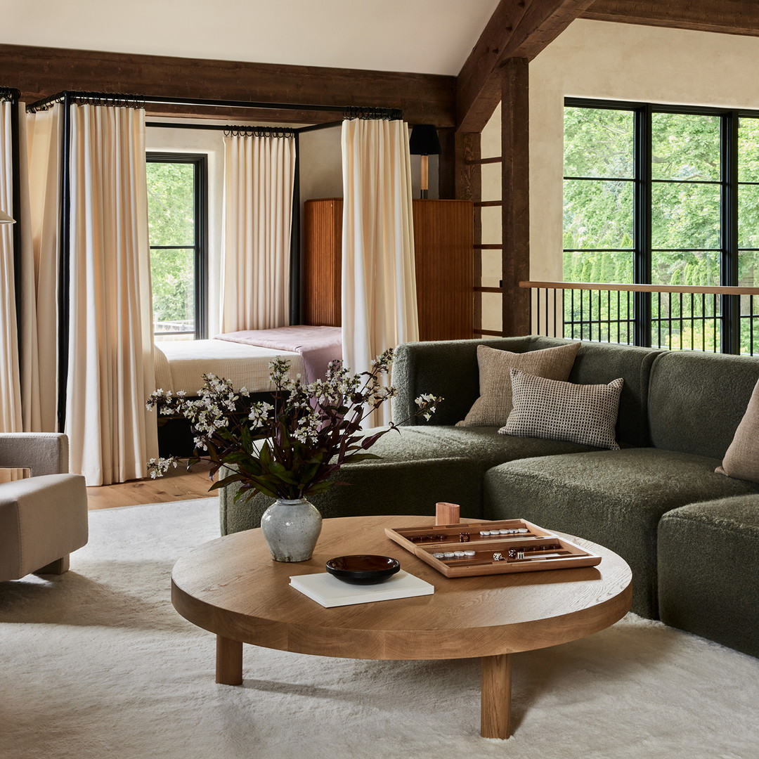 a living room filled with furniture and a large window