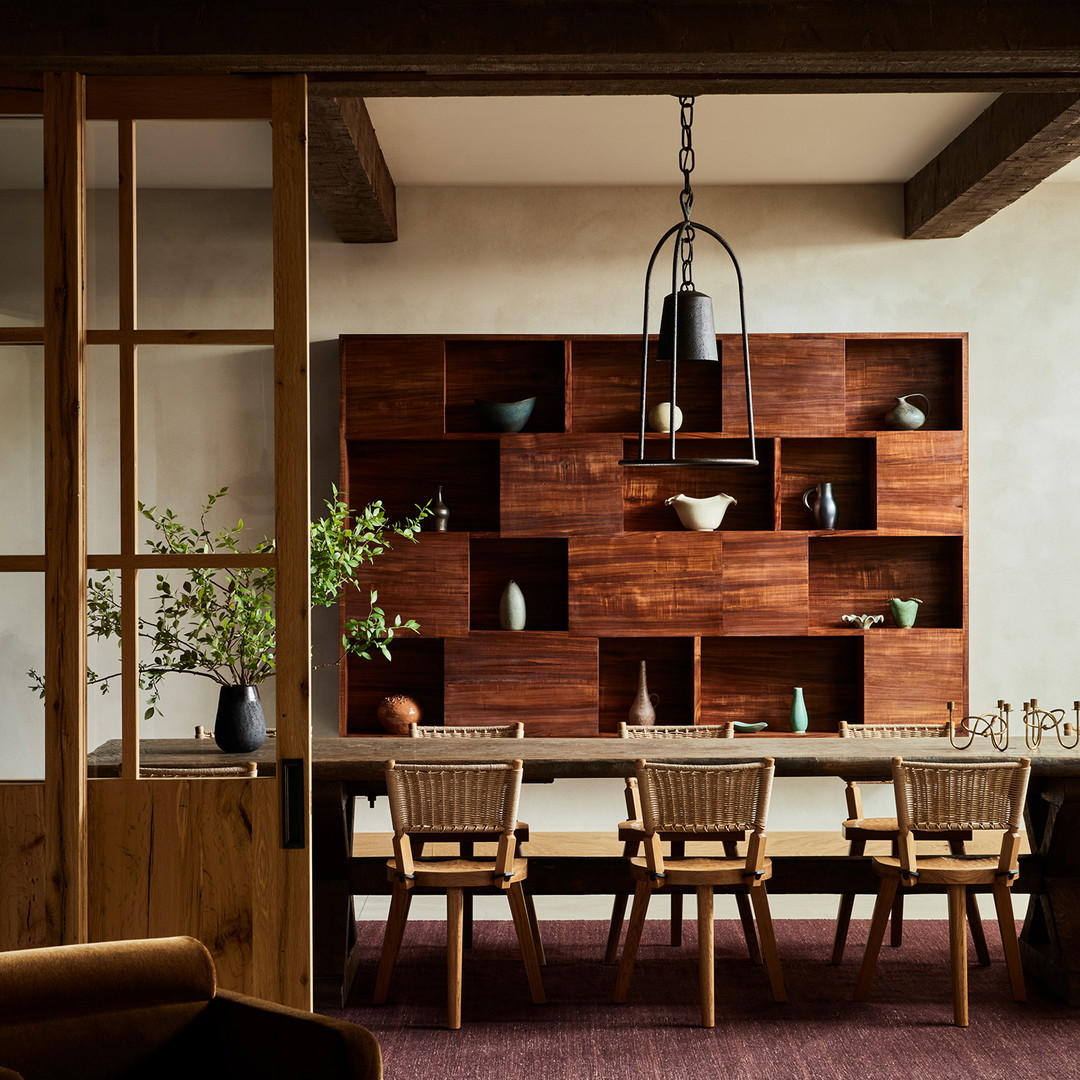 a dining room with a table and chairs