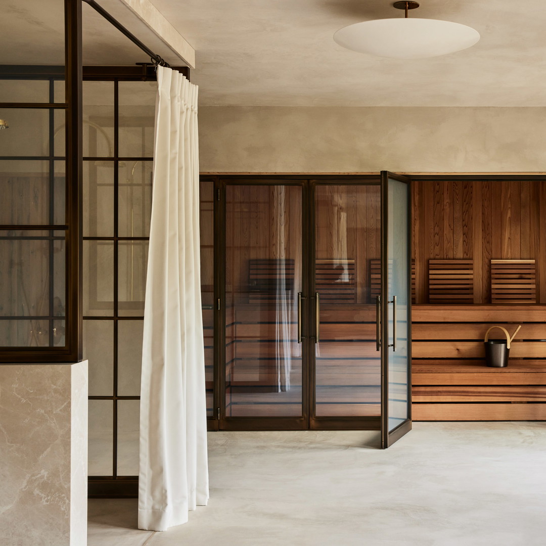 a room with a sauna and a bench in it