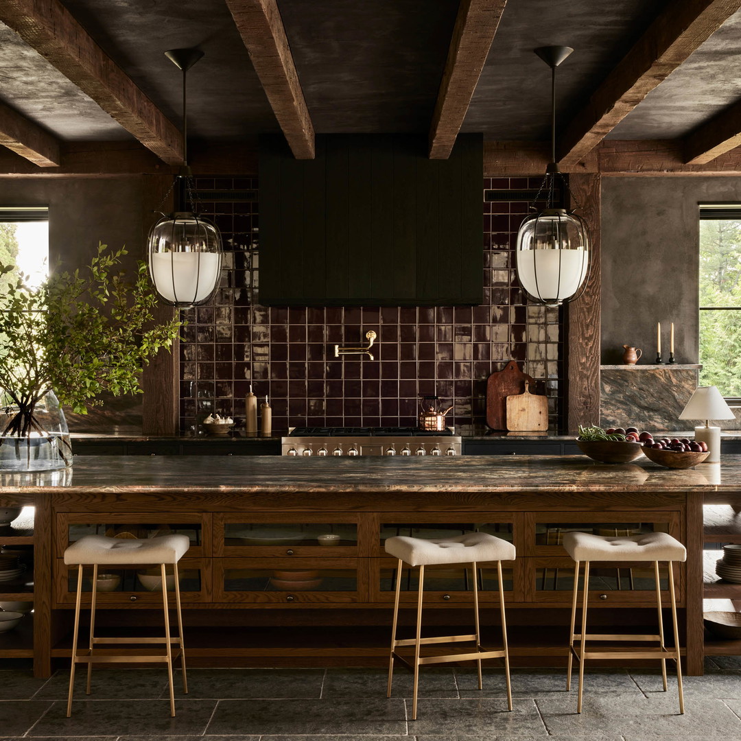 a large kitchen with a center island with stools