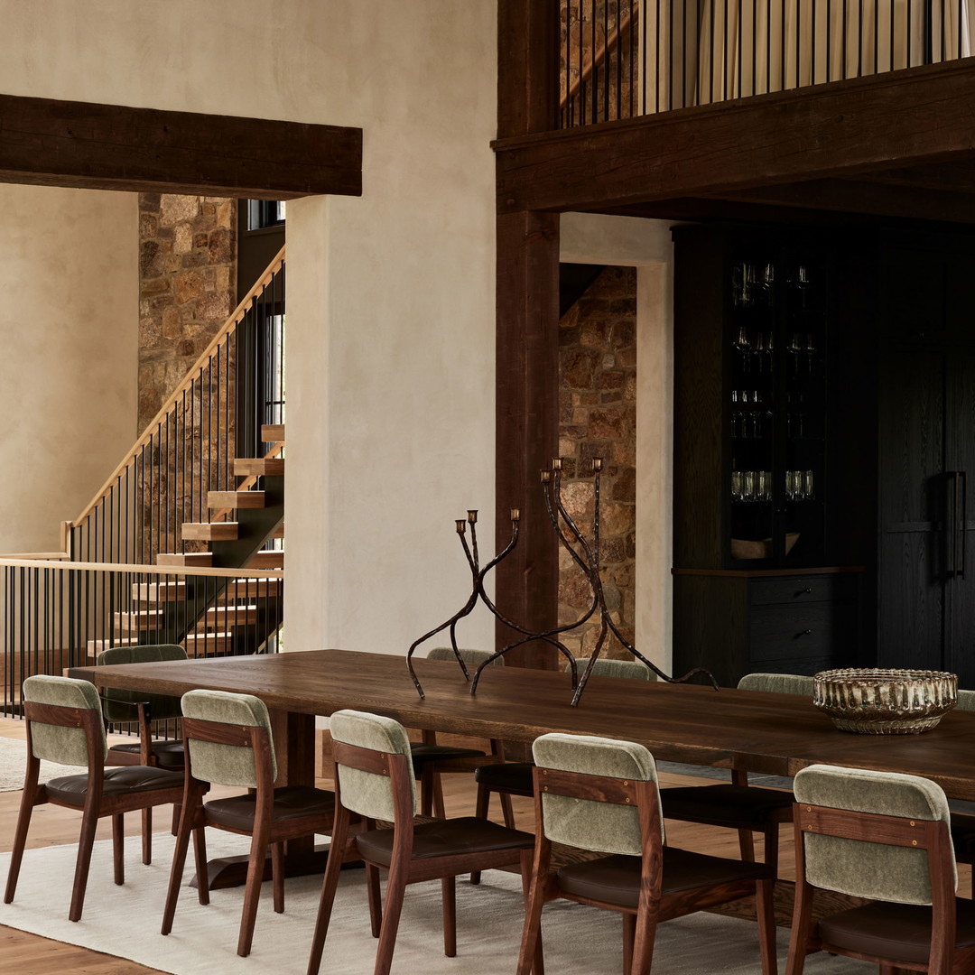 a dining room with a table and chairs