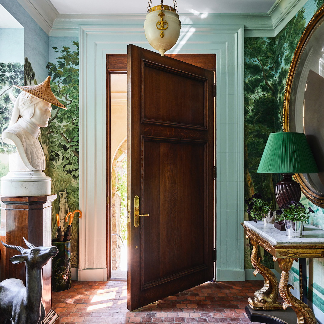 a room with a door and a statue of a cow