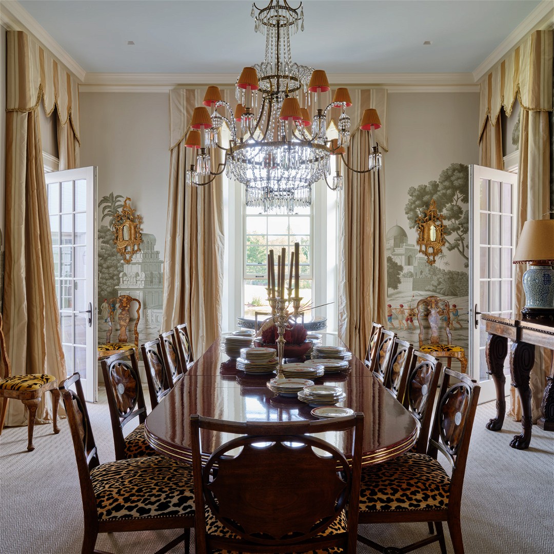 a dining room with a chandelier and a table