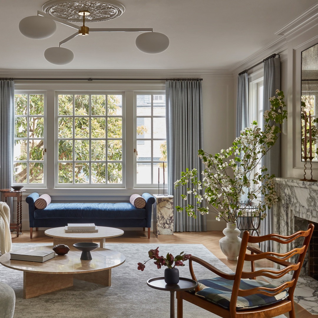 a living room filled with furniture and a fire place