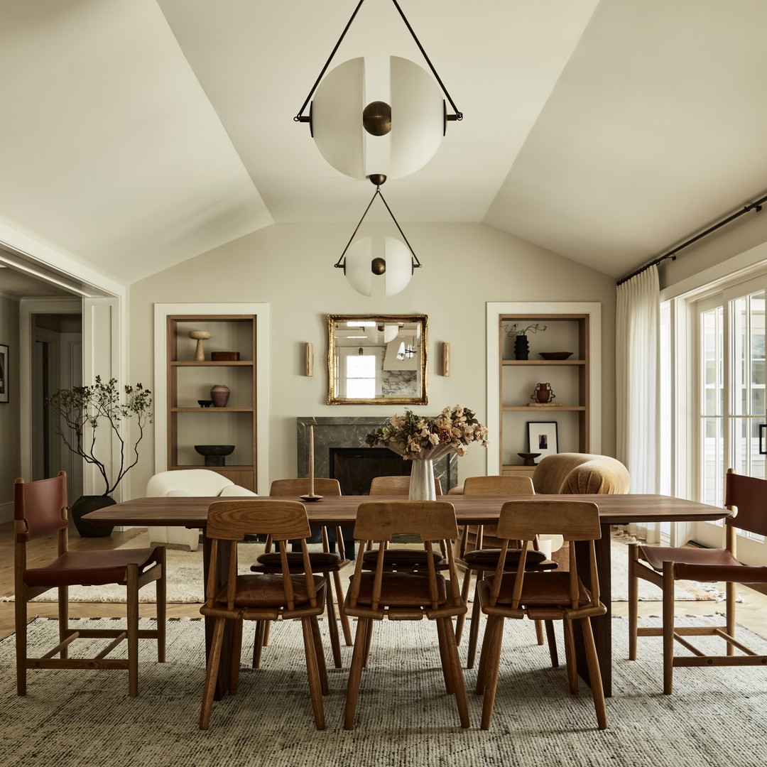 a dining room with a table and chairs